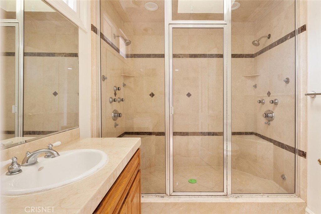 3734 Wrightwood Drive Studio City, CA 91604 - Photo 22 of 28 a bathroom with a shower and a sink