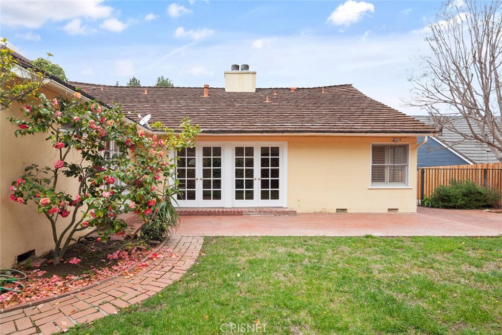 3734 Wrightwood Drive Studio City, CA 91604 - Photo 26 of 28 a front view of a house with a yard