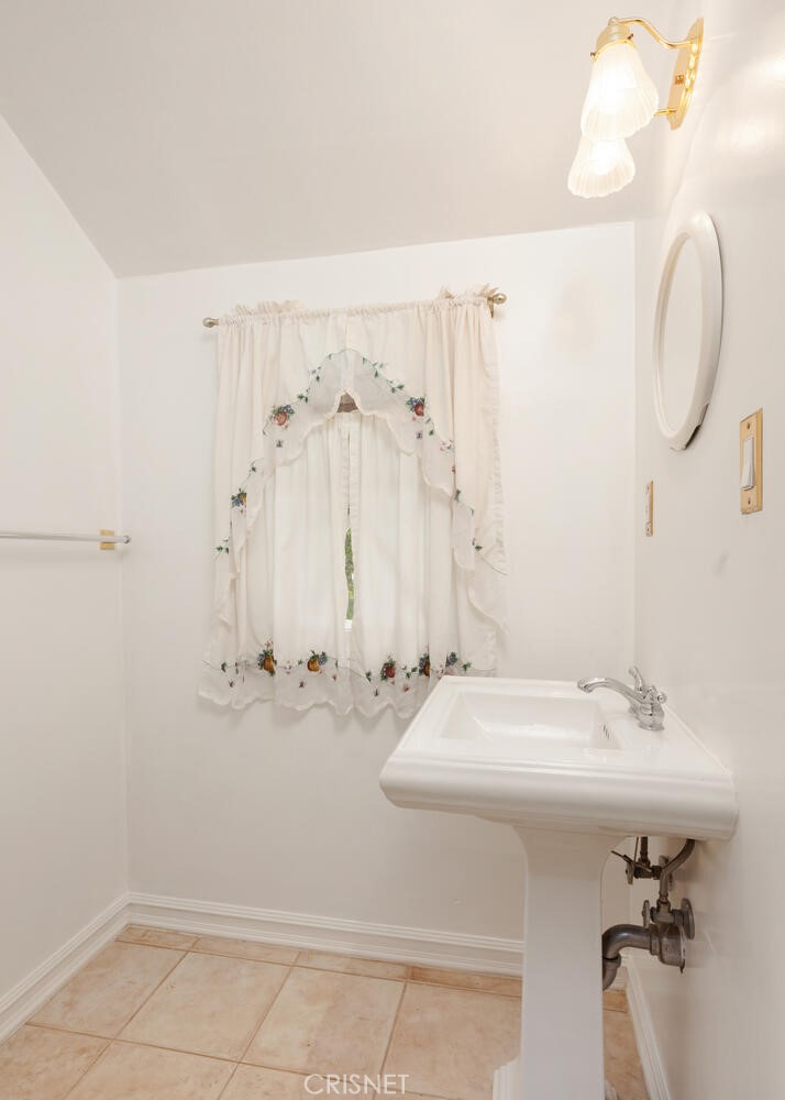 3734 Wrightwood Drive Studio City, CA 91604 - Photo 10 of 28 a bathroom with a sink and a mirror