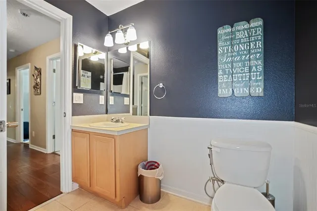 a utility room with sink dryer and appliances