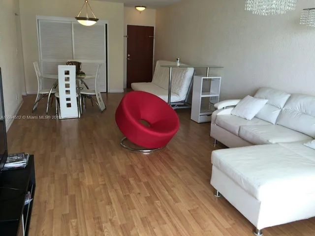 a hotel room with a bed and a couch