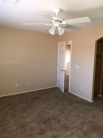 a bathroom with a bathtub and a glass door shower