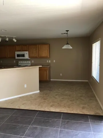 a view of a kitchen with a sink