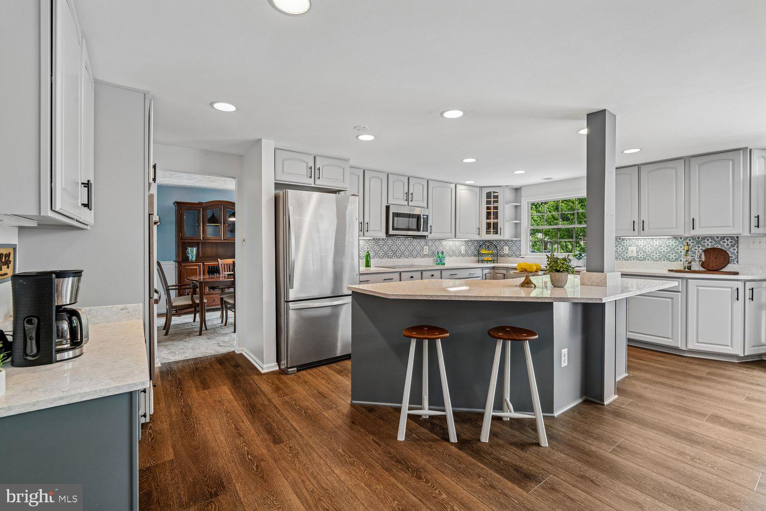 8044 Red Jacket Way Jessup, MD 20794 - Photo 16 of 71 STRIKING CHEF'S KITCHEN W/ CUSTOM TILE BACKSPLASH