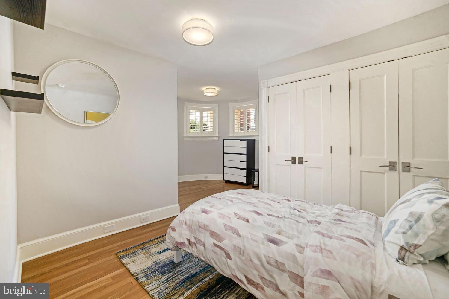 3348 Prospect Street Northwest, Unit 1 Washington, DC 20007 - Photo 7 of 16 a bedroom with a bed and a window
