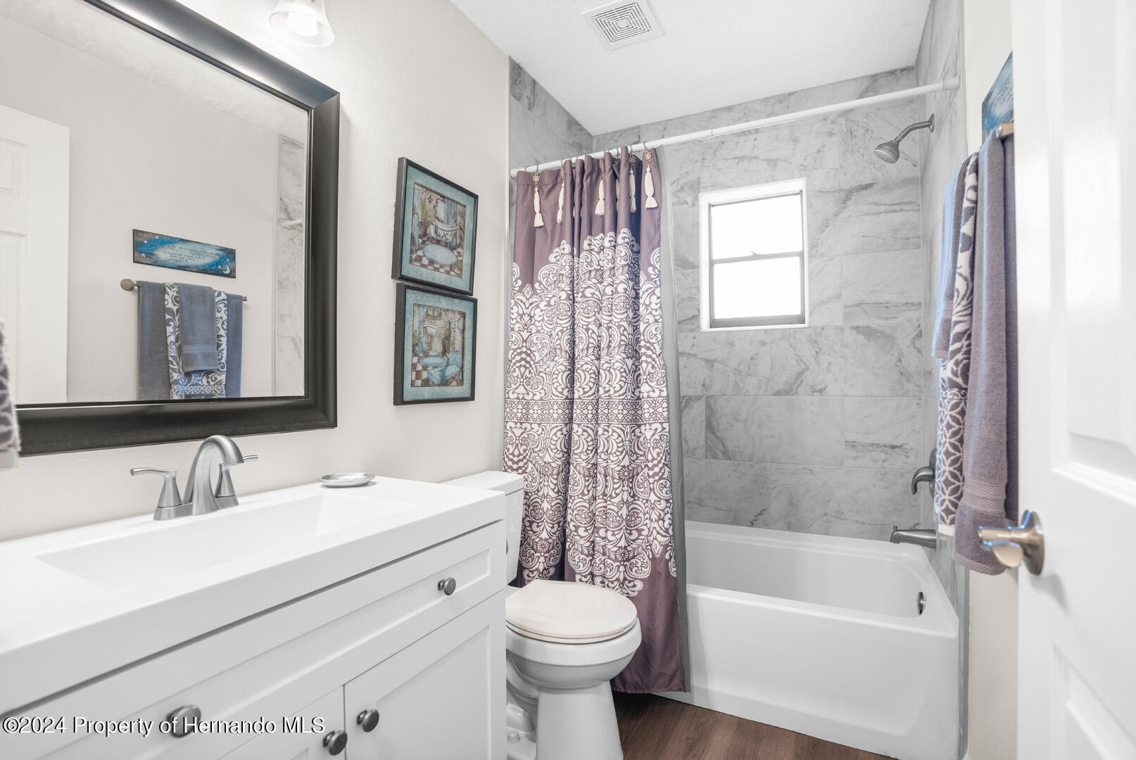 2004 Nobleton Avenue Spring Hill, FL 34608 - Photo 13 of 38 a bathroom with a sink toilet and shower