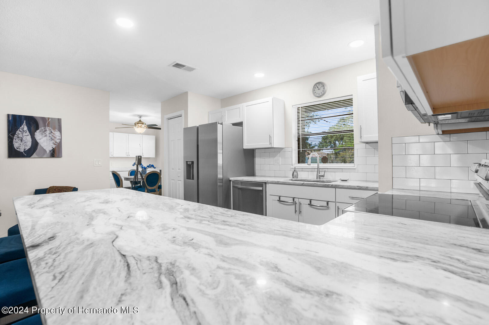 2004 Nobleton Avenue Spring Hill, FL 34608 - Photo 16 of 38 a bathroom with a sink a large mirror and shower