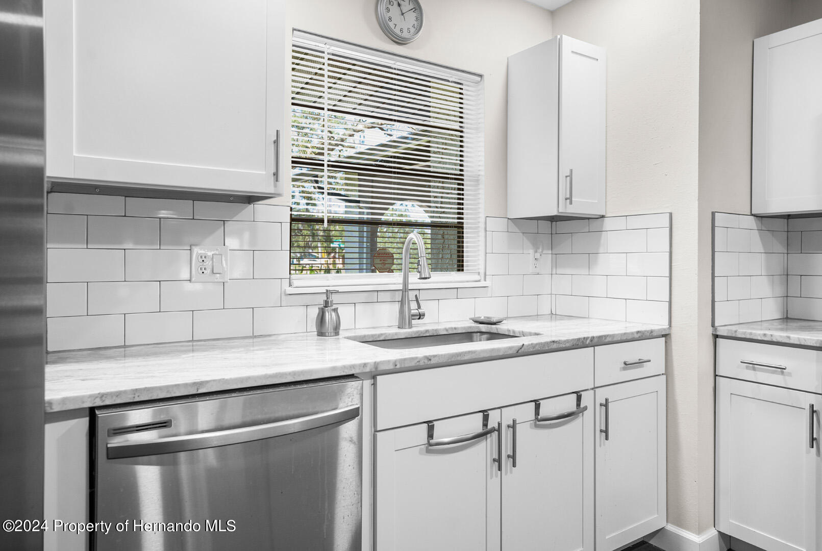 2004 Nobleton Avenue Spring Hill, FL 34608 - Photo 18 of 38 a kitchen with a sink cabinets and window