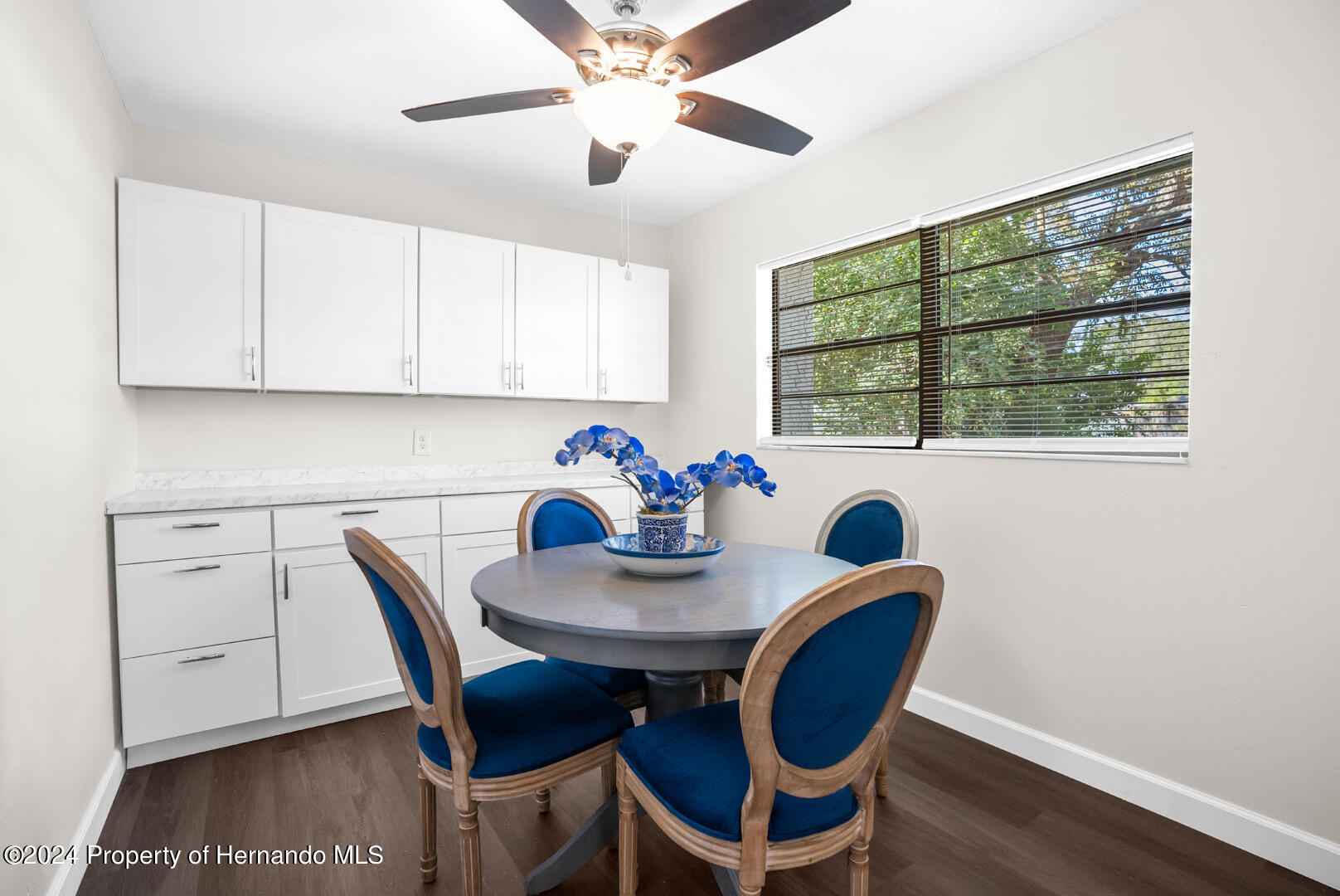 2004 Nobleton Avenue Spring Hill, FL 34608 - Photo 19 of 38 a view of a dining room with furniture window and wooden floor