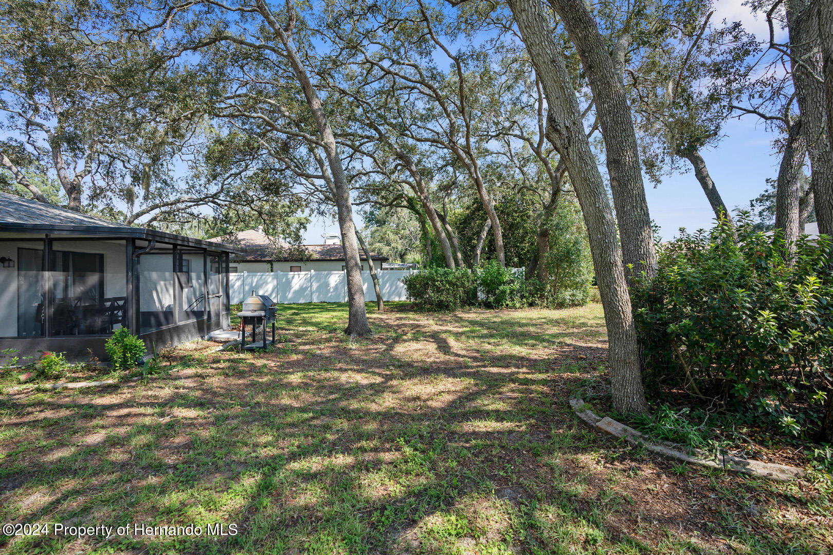 2004 Nobleton Avenue Spring Hill, FL 34608 - Photo 31 of 38 a view of a house with yard and tree s