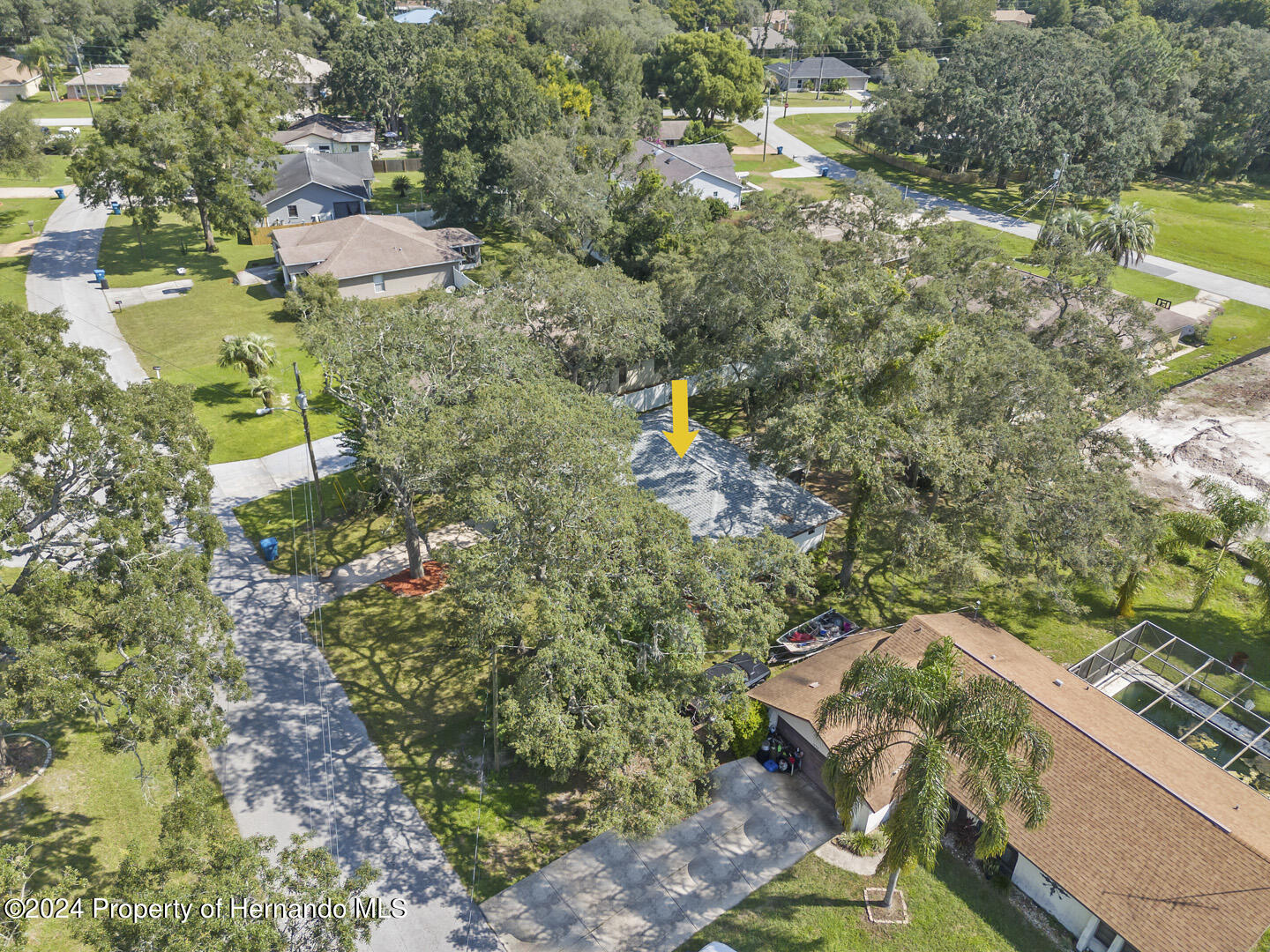 2004 Nobleton Avenue Spring Hill, FL 34608 - Photo 32 of 38 a view of a lake with a house