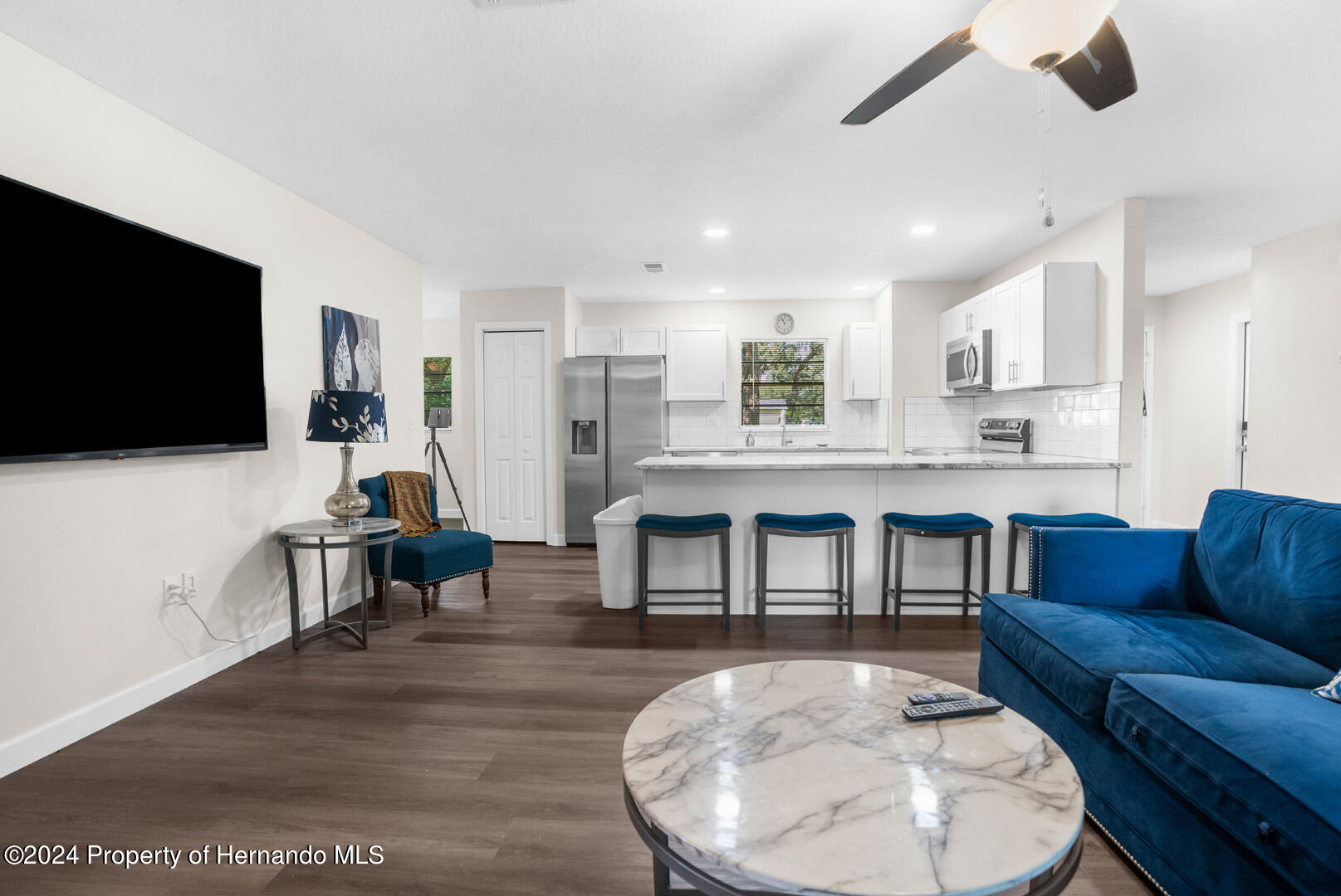2004 Nobleton Avenue Spring Hill, FL 34608 - Photo 9 of 38 a living room with furniture and a flat screen tv