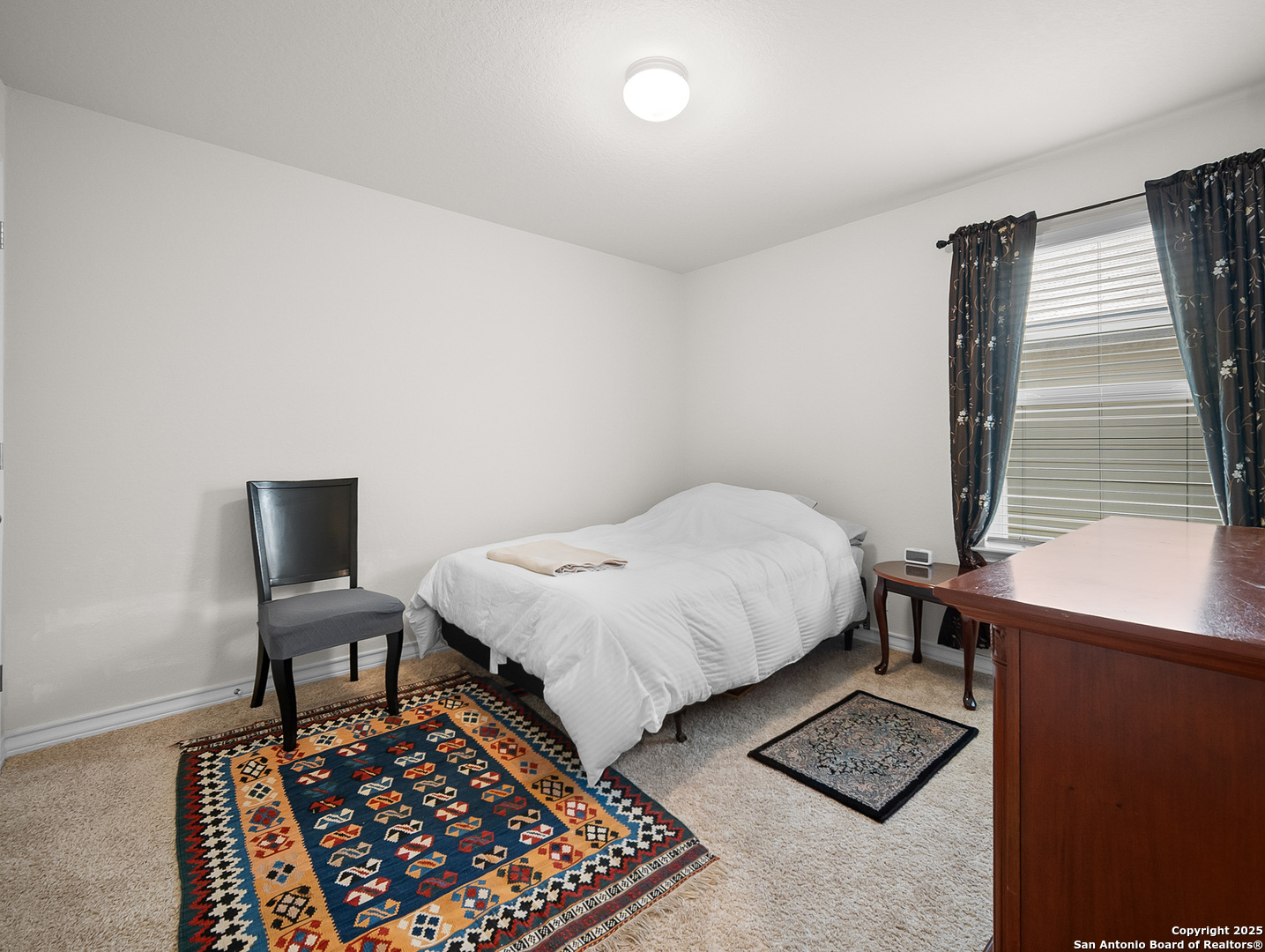 5022 Dancing Gopher San Antonio, TX 78261 - Photo 13 of 36 a bedroom with a bed and a window