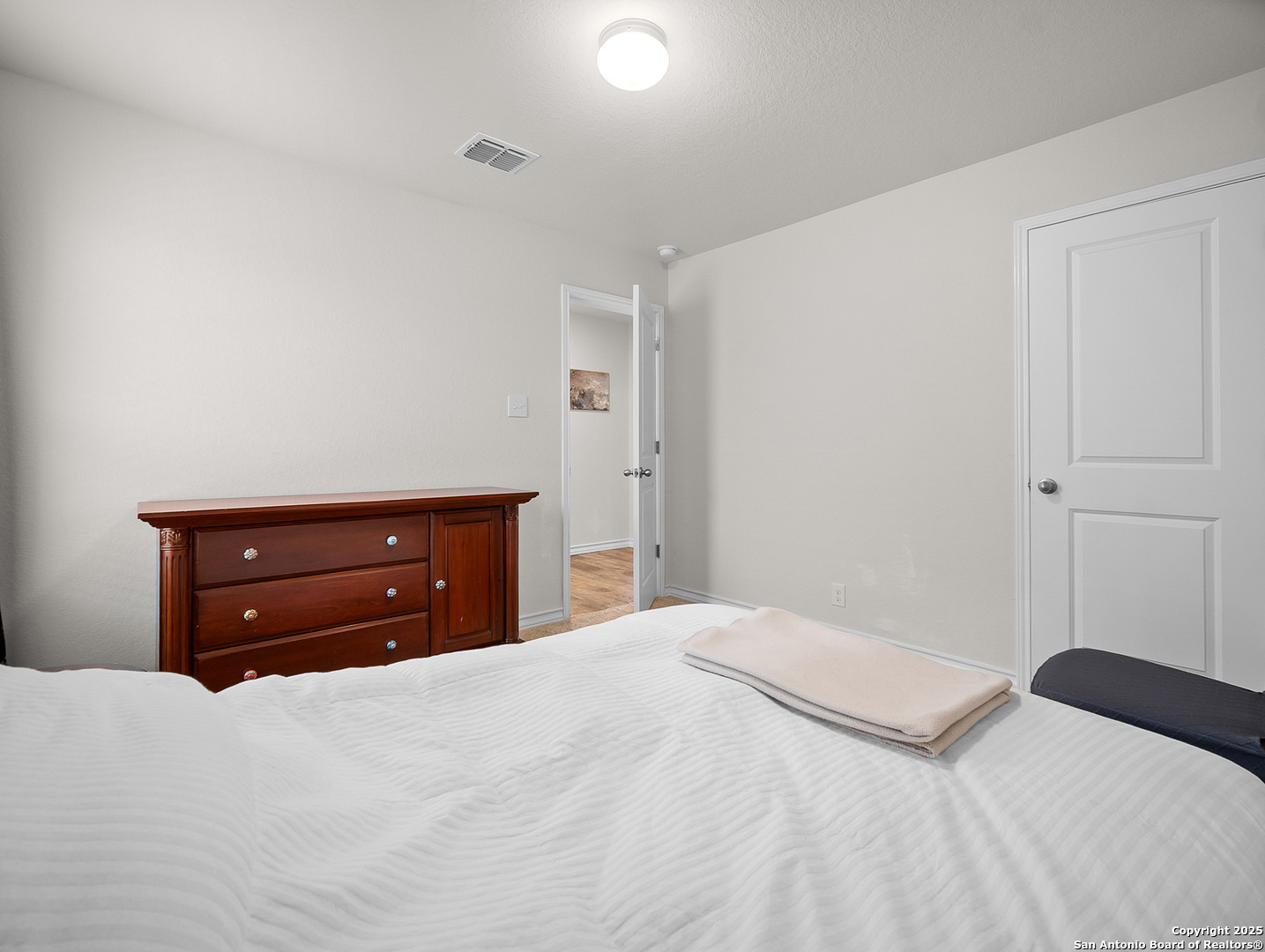 5022 Dancing Gopher San Antonio, TX 78261 - Photo 14 of 36 a bedroom with a bed and a dresser