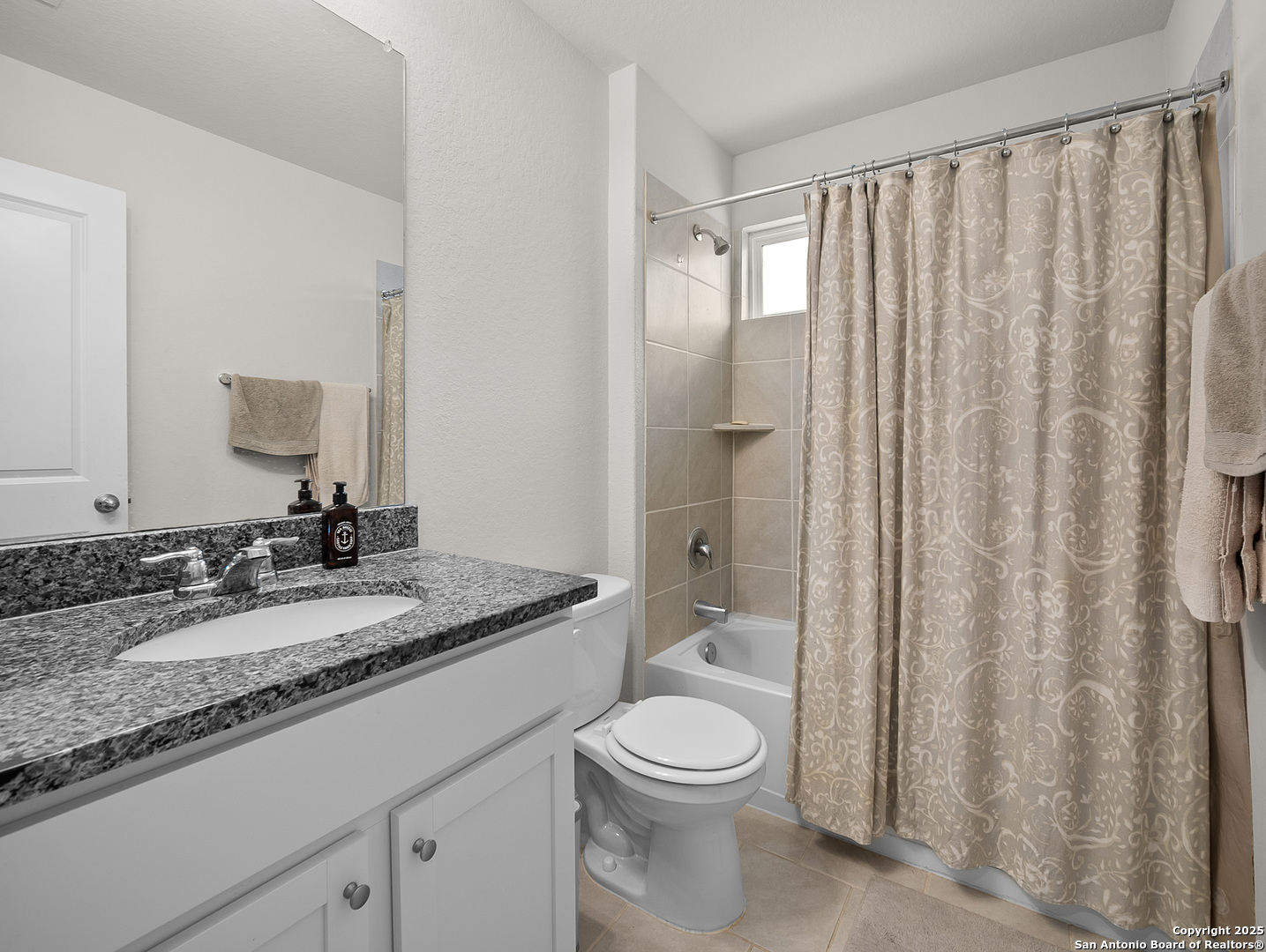5022 Dancing Gopher San Antonio, TX 78261 - Photo 15 of 36 a bathroom with a granite countertop sink toilet and shower