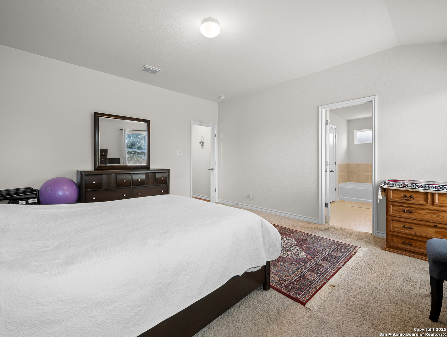 5022 Dancing Gopher San Antonio, TX 78261 - Photo 20 of 36 a bedroom with a bed and dresser