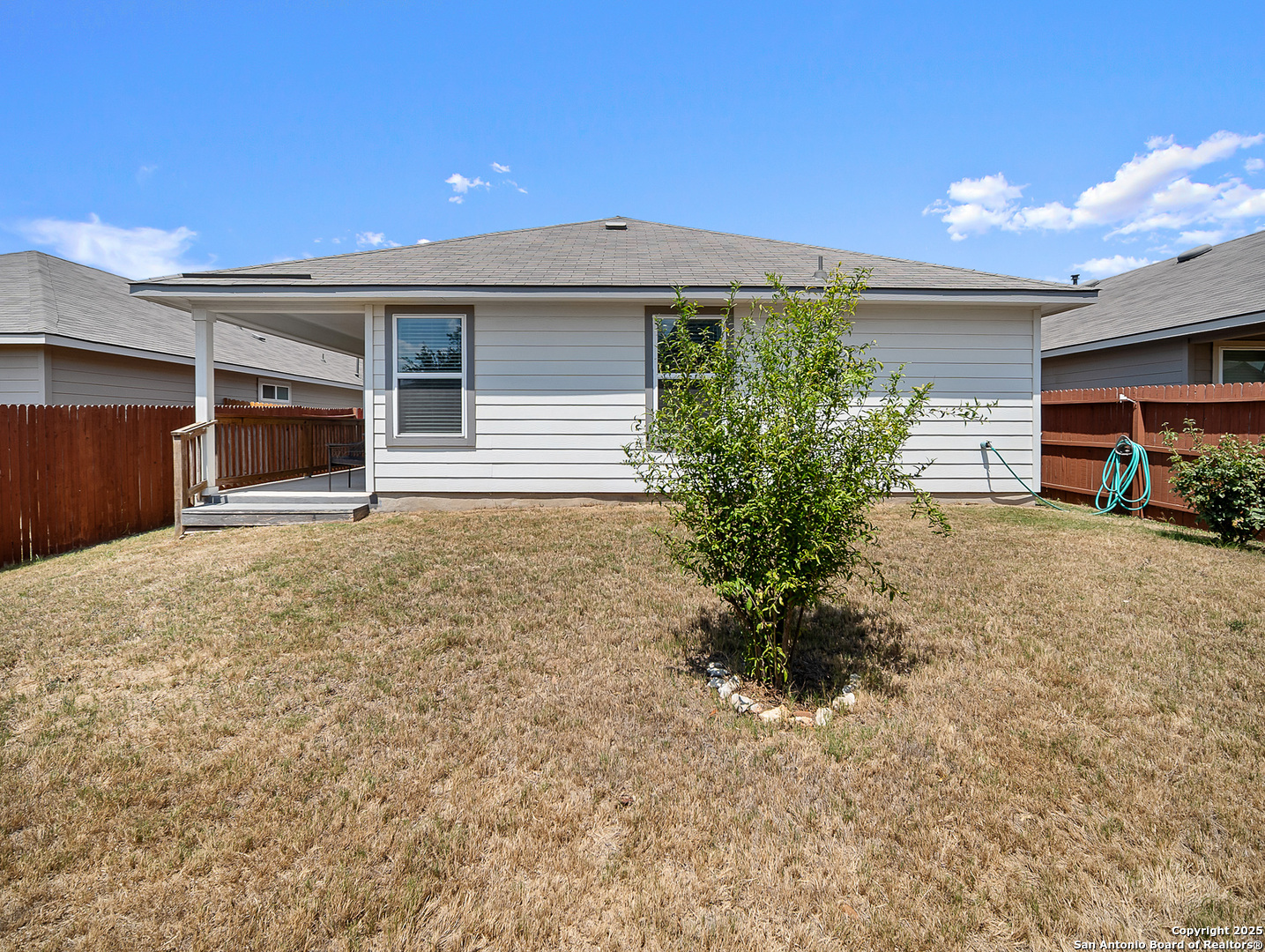 5022 Dancing Gopher San Antonio, TX 78261 - Photo 24 of 36 a front view of house with yard and trees in the background