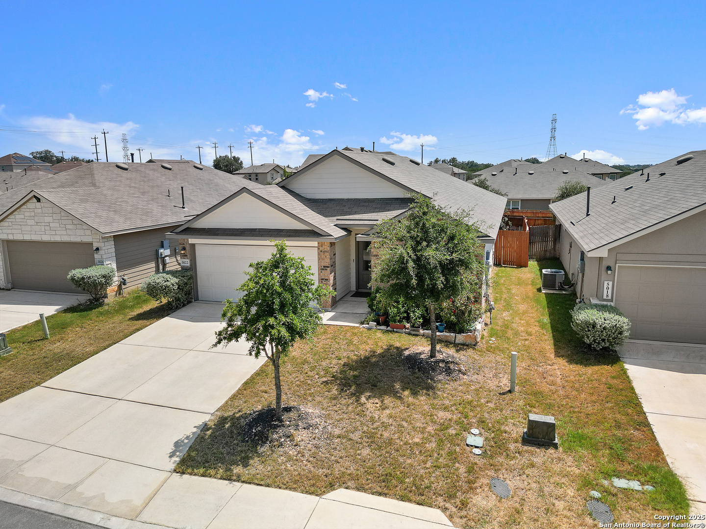 5022 Dancing Gopher San Antonio, TX 78261 - Photo 26 of 36 a front view of a house with a yard and garage