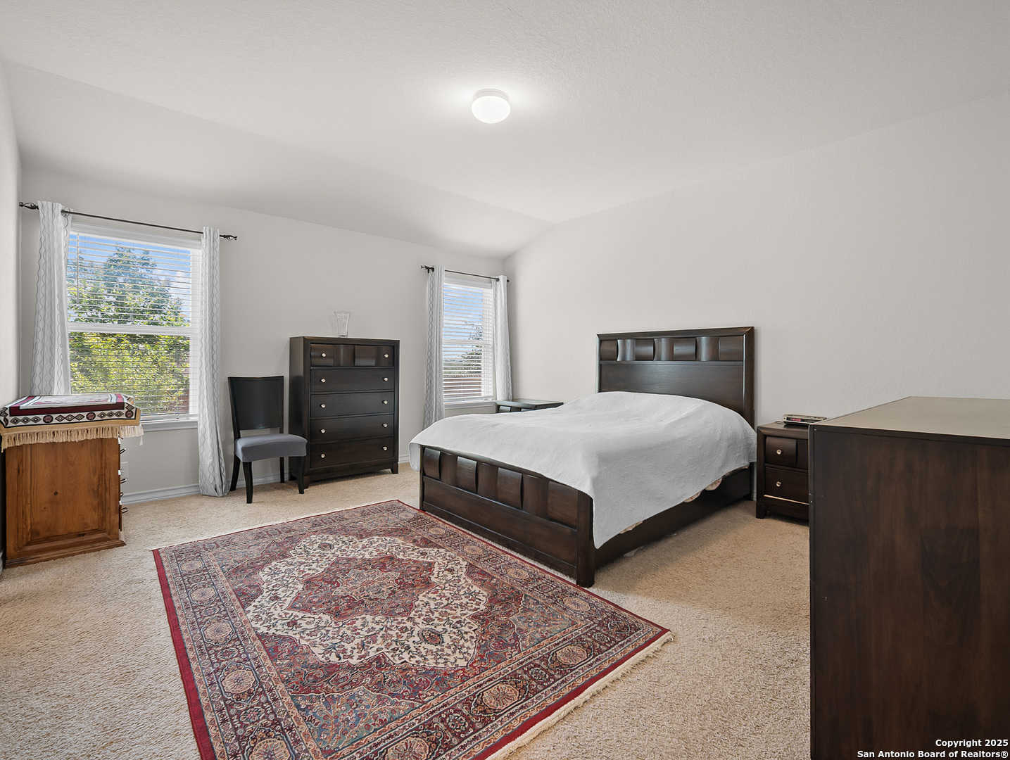 5022 Dancing Gopher San Antonio, TX 78261 - Photo 6 of 36 a bedroom with a bed a table and a fireplace