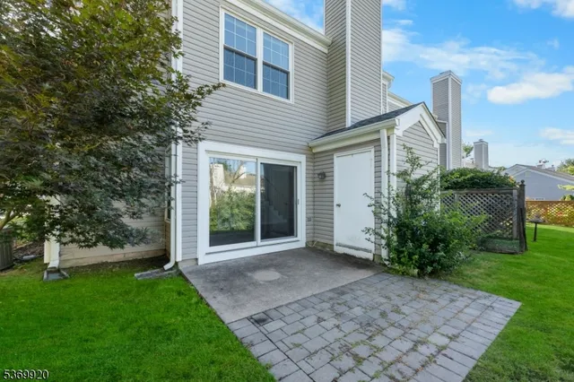 a view of a house with a yard and plants