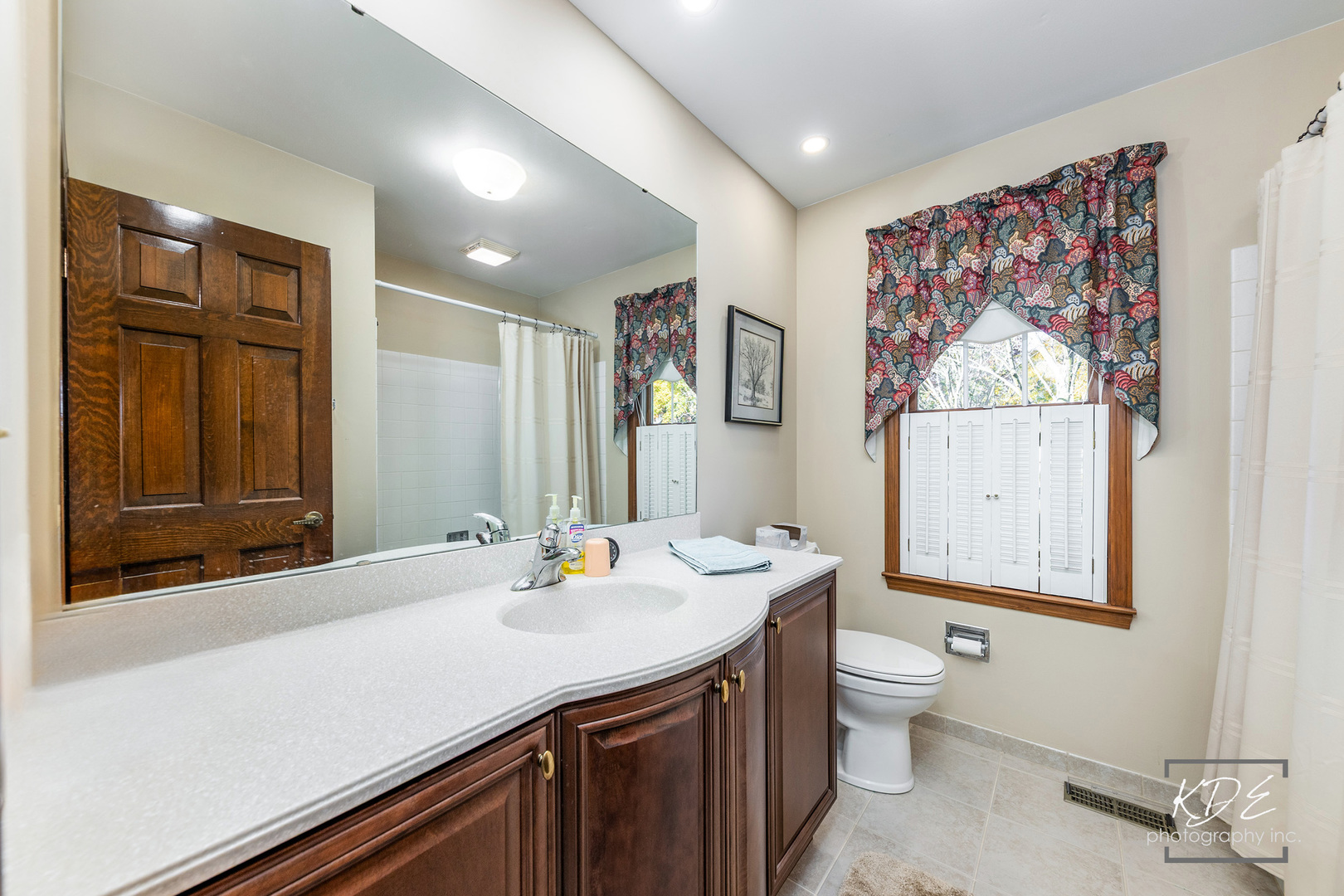 923 Tim Tam Circle Naperville, IL 60540 - Photo 19 of 28 a bathroom with a granite countertop sink mirror and toilet