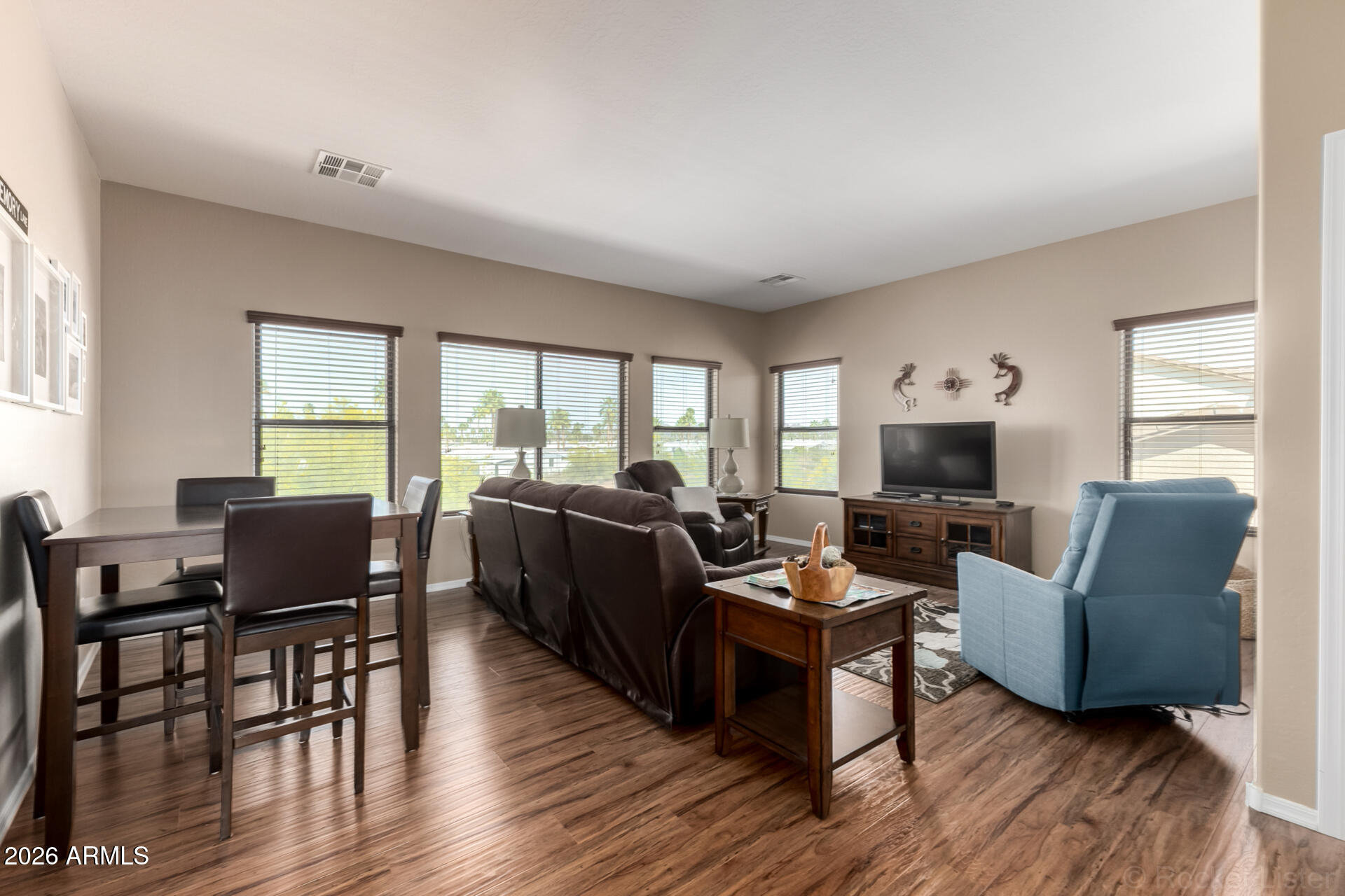 2756 South Powell Road Apache Junction, AZ 85119 - Photo 11 of 37 a living room with furniture a flat screen tv and a large window