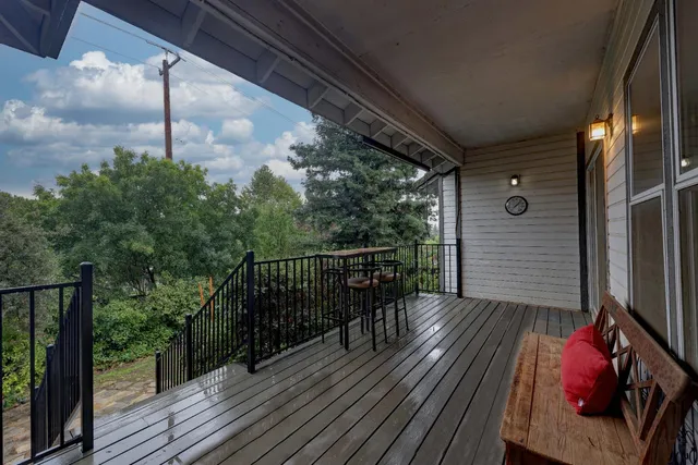 a balcony with wooden floor
