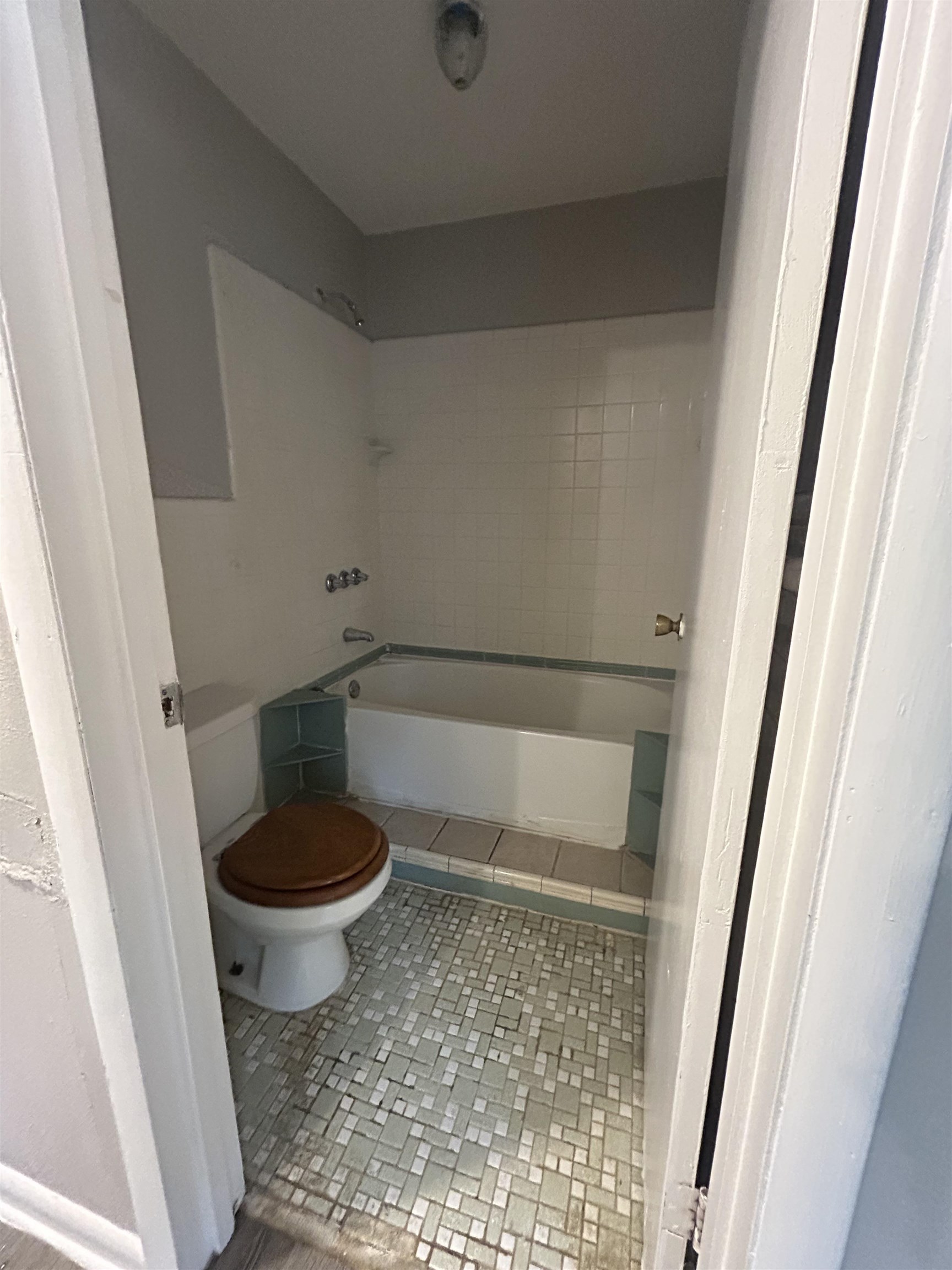 4631 Sea Isle Road Memphis, TN 38117 - Photo 16 of 28 Full bathroom featuring toilet, tile patterned floors, and shower / washtub combination