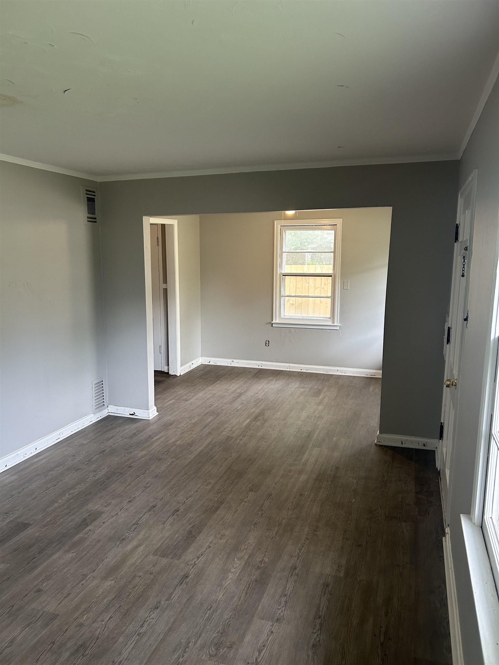 4631 Sea Isle Road Memphis, TN 38117 - Photo 5 of 28 Unfurnished room featuring ornamental molding, dark wood-type flooring, and baseboards