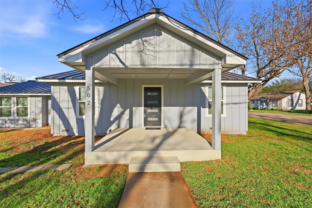 502 Madison Street Cleburne, TX 76033 - Photo 28 of 30 a front view of a house with garden