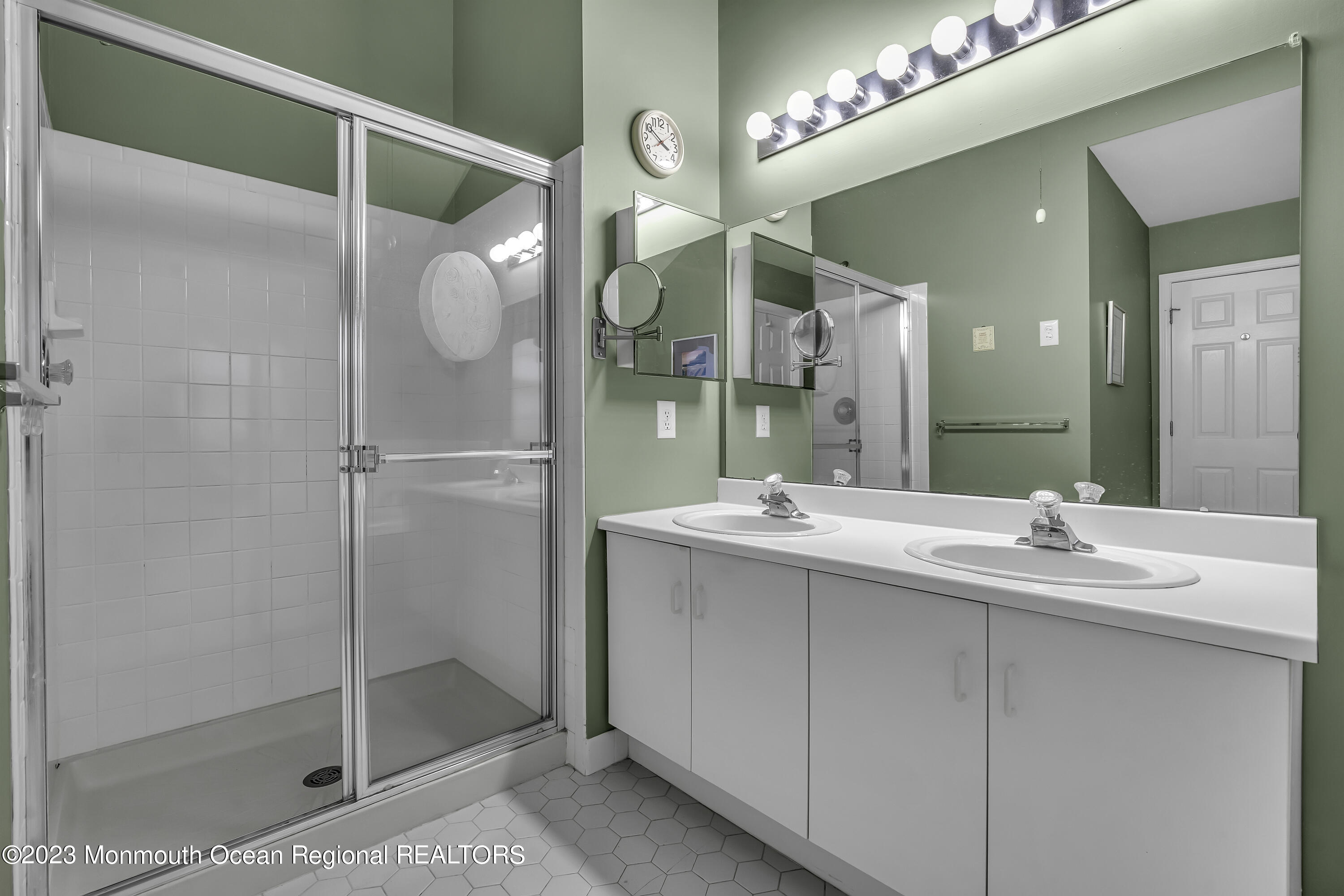 8 Alpine Road, Unit 197 Holmdel, NJ 07733 - Photo 11 of 18 a bathroom with a double vanity sink mirror and shower