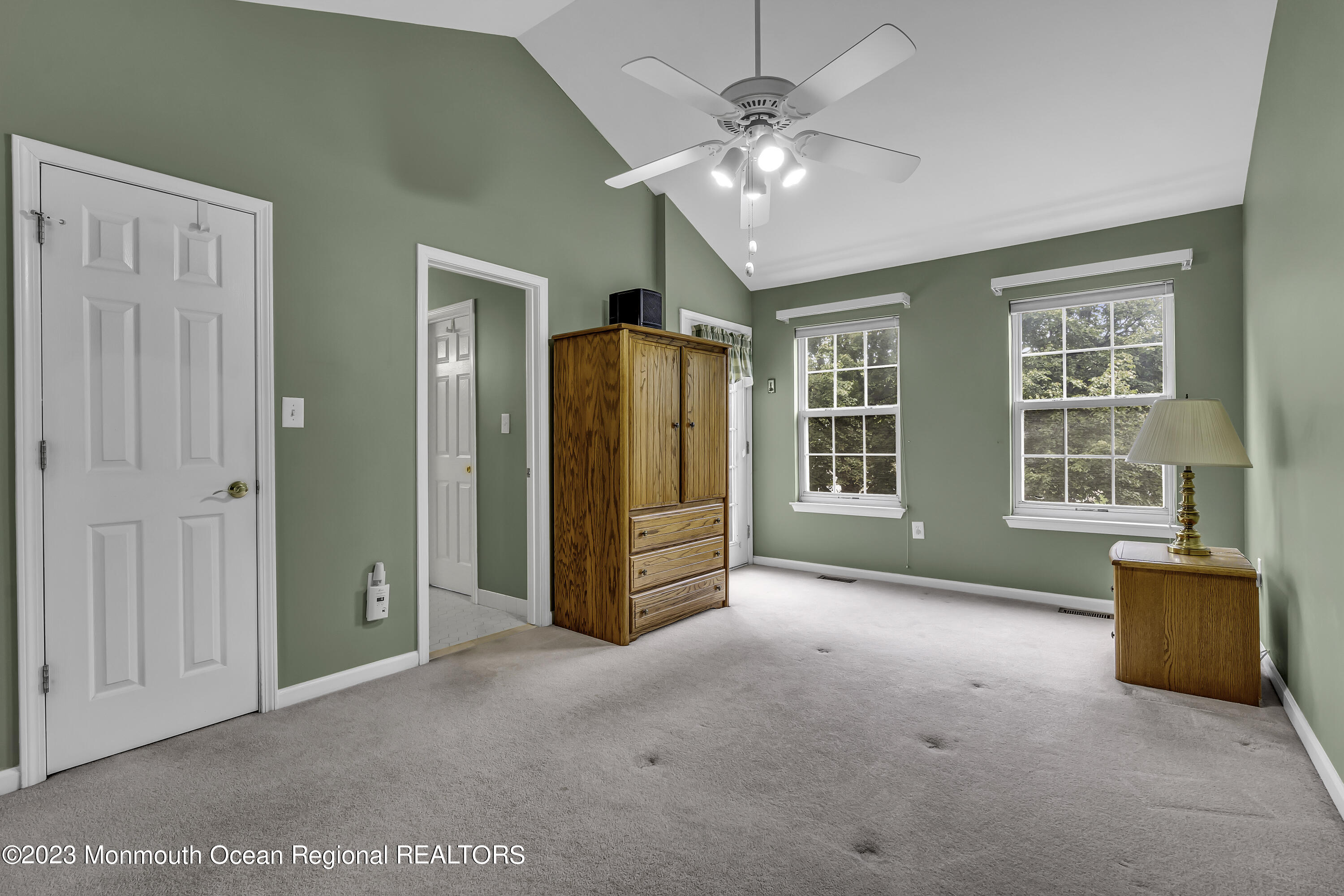 8 Alpine Road, Unit 197 Holmdel, NJ 07733 - Photo 13 of 18 an empty room with chandelier fan and windows