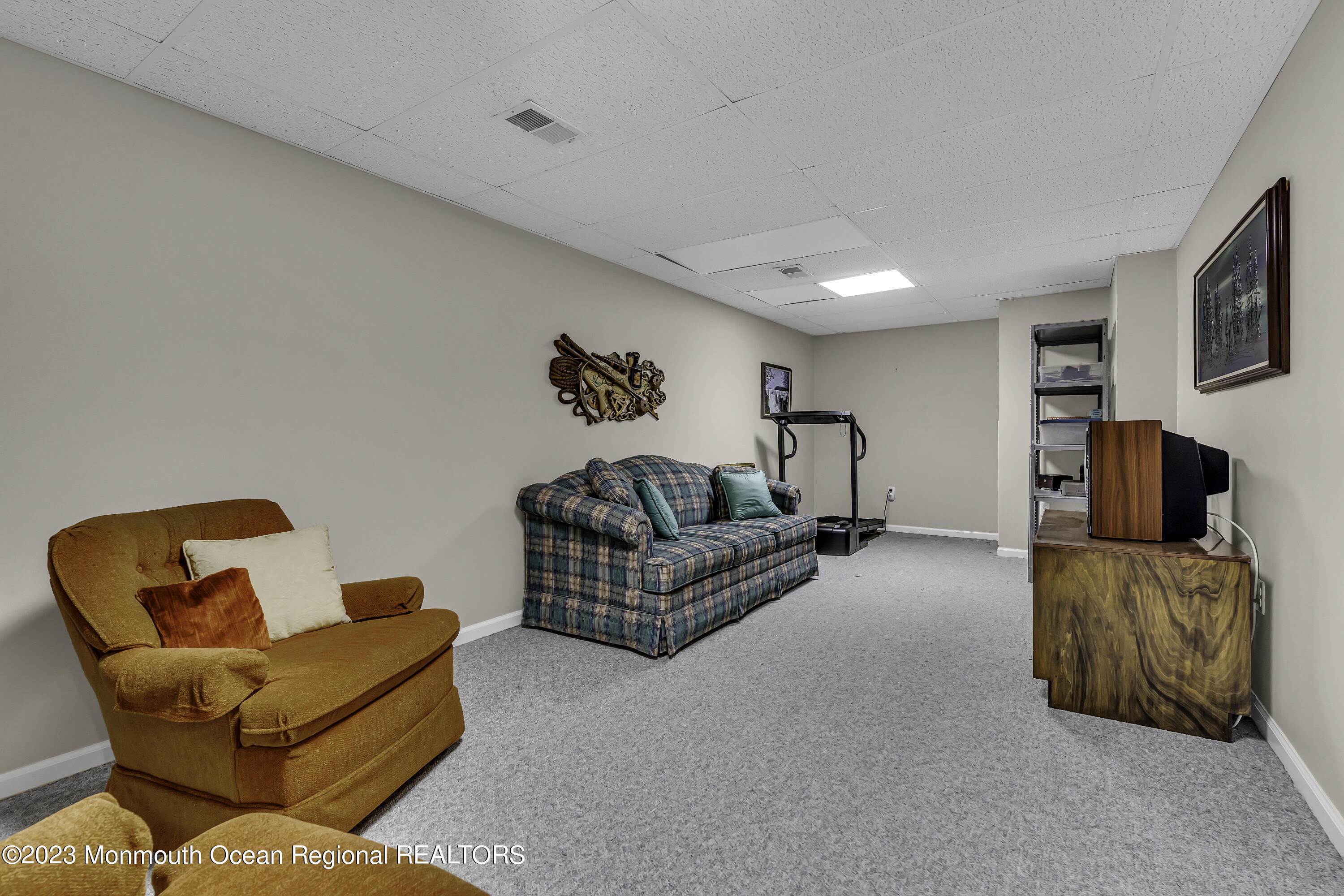 8 Alpine Road, Unit 197 Holmdel, NJ 07733 - Photo 16 of 18 a living room with furniture and a couch