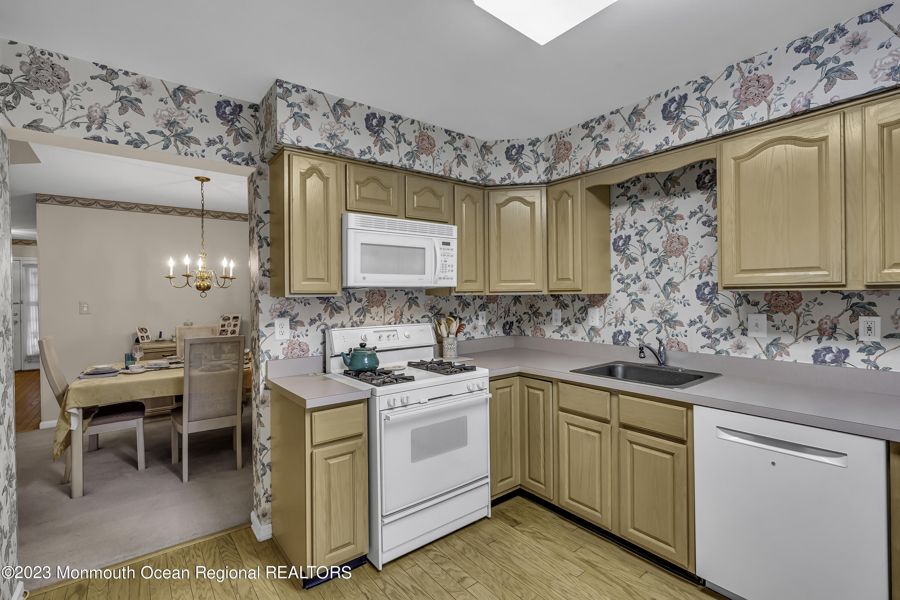 8 Alpine Road, Unit 197 Holmdel, NJ 07733 - Photo 6 of 18 a kitchen with a sink stove and cabinets