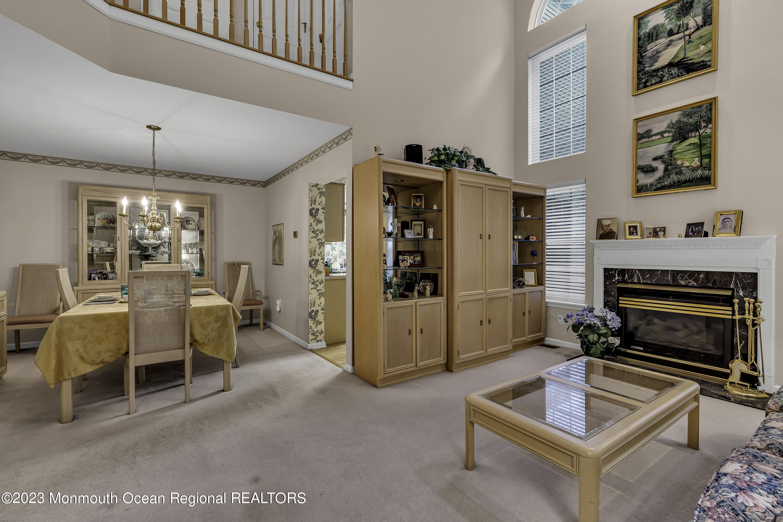 8 Alpine Road, Unit 197 Holmdel, NJ 07733 - Photo 7 of 18 a living room with furniture a flat screen tv and a fireplace