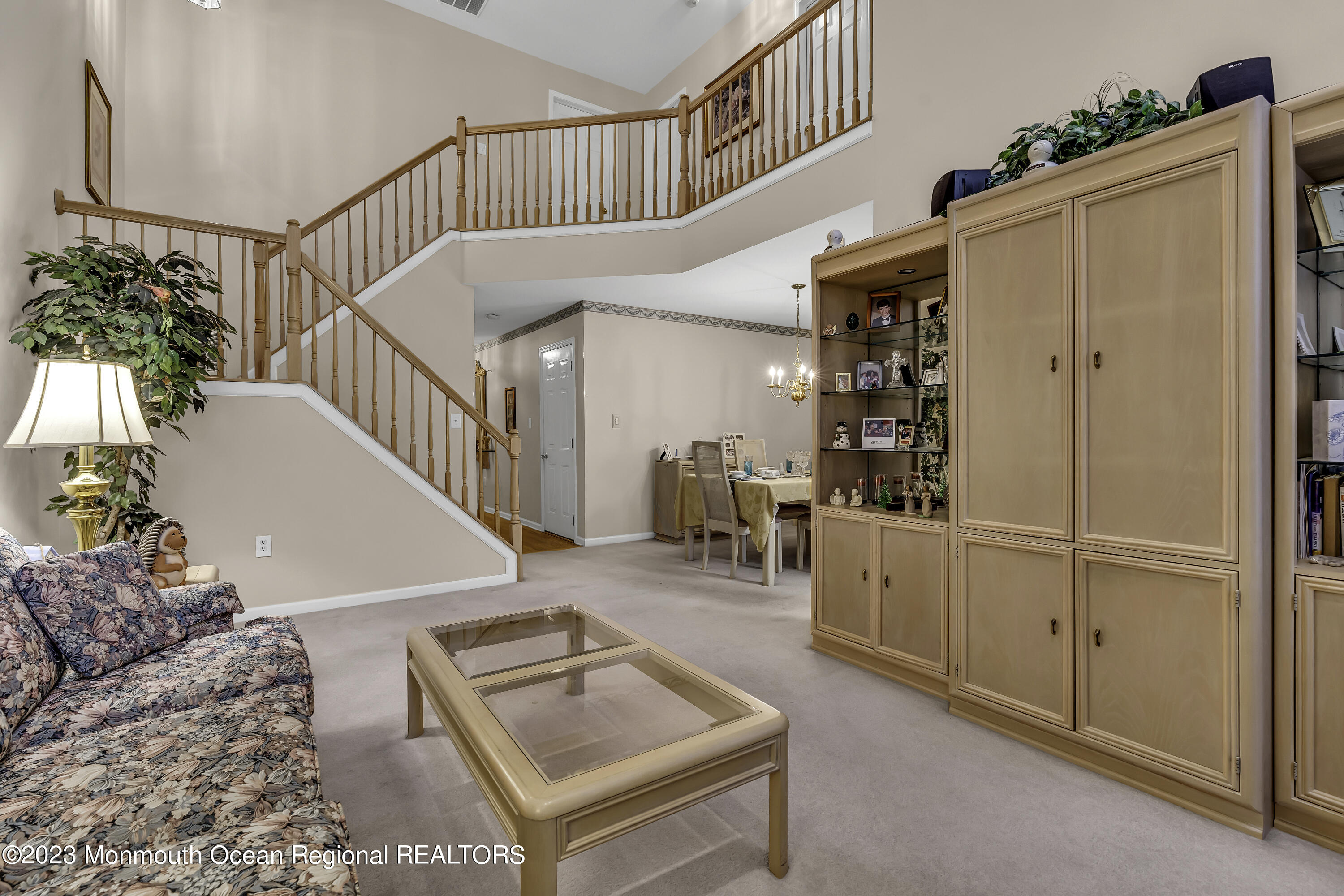 8 Alpine Road, Unit 197 Holmdel, NJ 07733 - Photo 8 of 18 a living room with furniture and a table