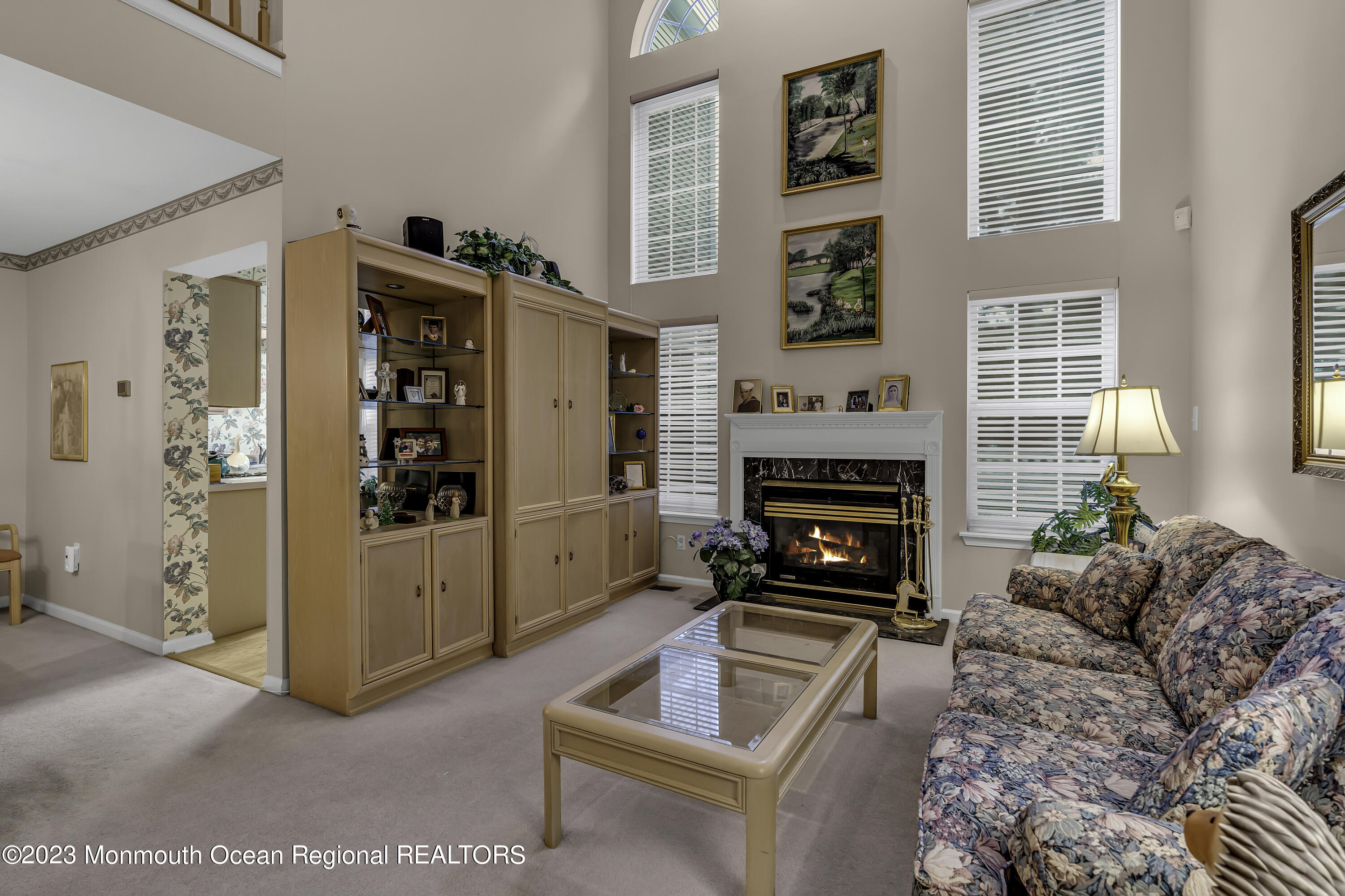 8 Alpine Road, Unit 197 Holmdel, NJ 07733 - Photo 9 of 18 a living room with furniture and a fireplace