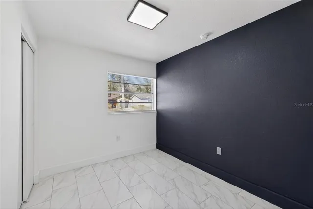 an empty room with windows