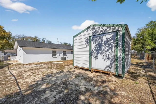 a view of a house with a snow in the background
