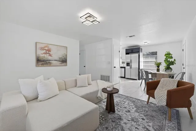 a living room with furniture and a table