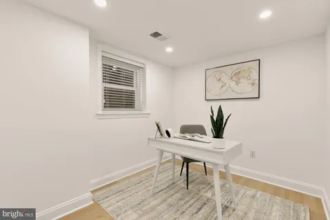 a workspace with furniture and a window