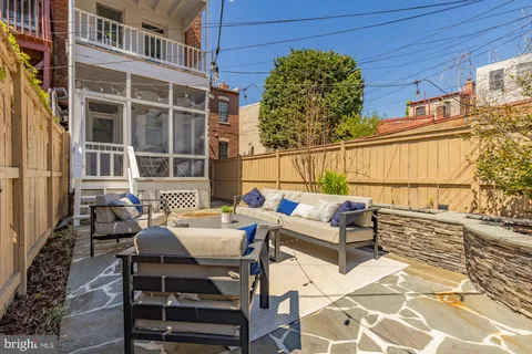 a building outdoor space with patio furniture