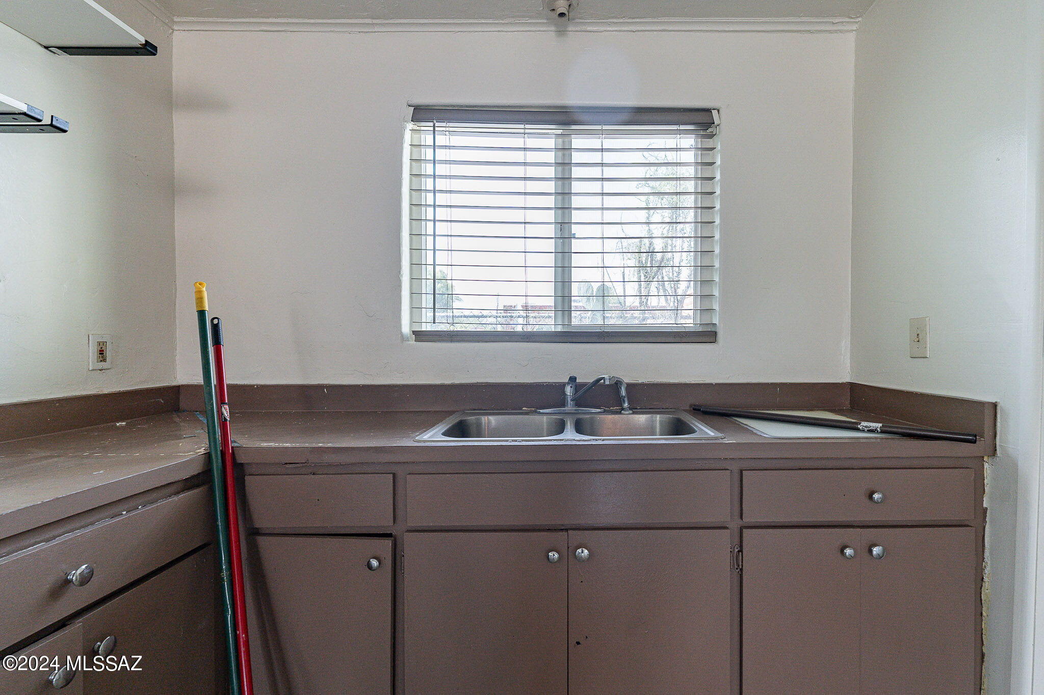 608 East Roger Road Tucson, AZ 85705 - Photo 4 of 13 a kitchen with a sink and a window