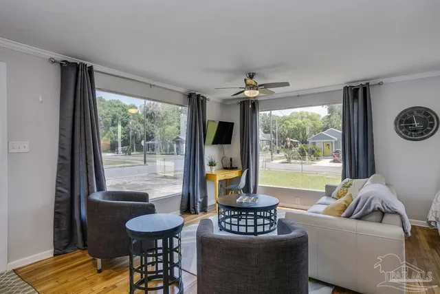 a living room with furniture and a large window