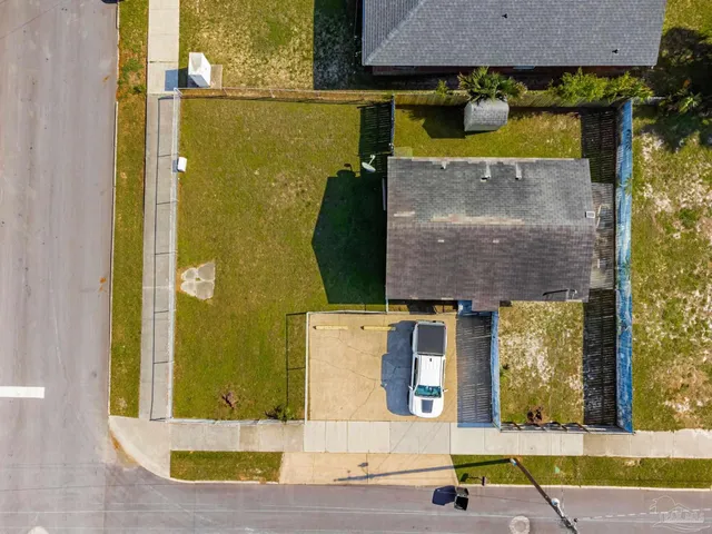 an aerial view of a house with a swimming pool