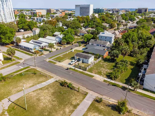 an aerial view of residential houses with outdoor space