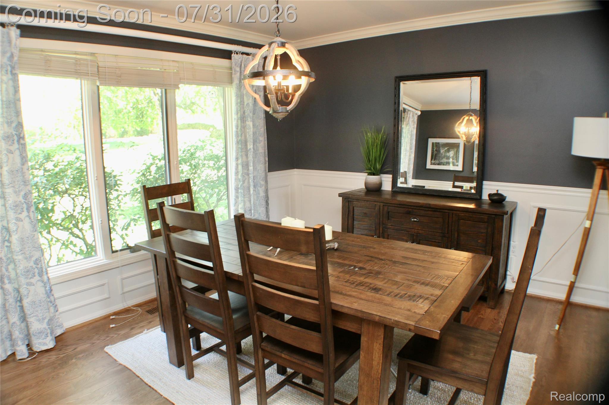 362 Lake Forest Road Rochester, MI 48309 - Photo 12 of 50 Dining area featuring dark accent walls with white wainscoting and crown molding