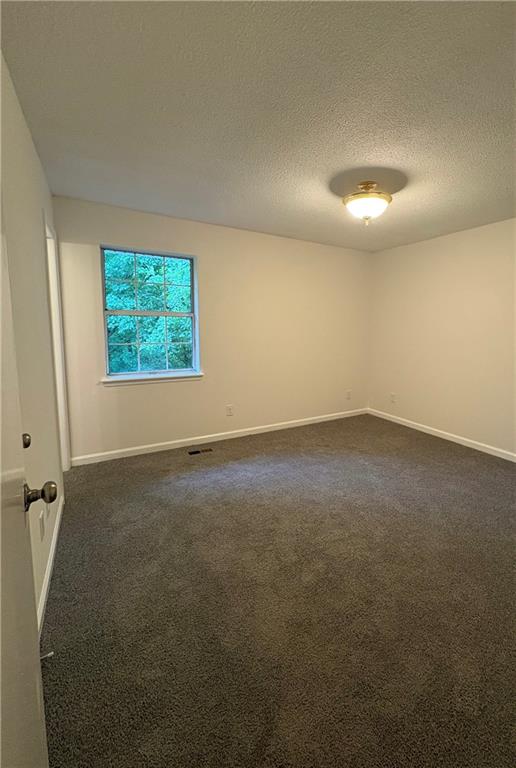 643 Akins Road Chickamauga, GA 30707 - Photo 11 of 14 an empty room with windows