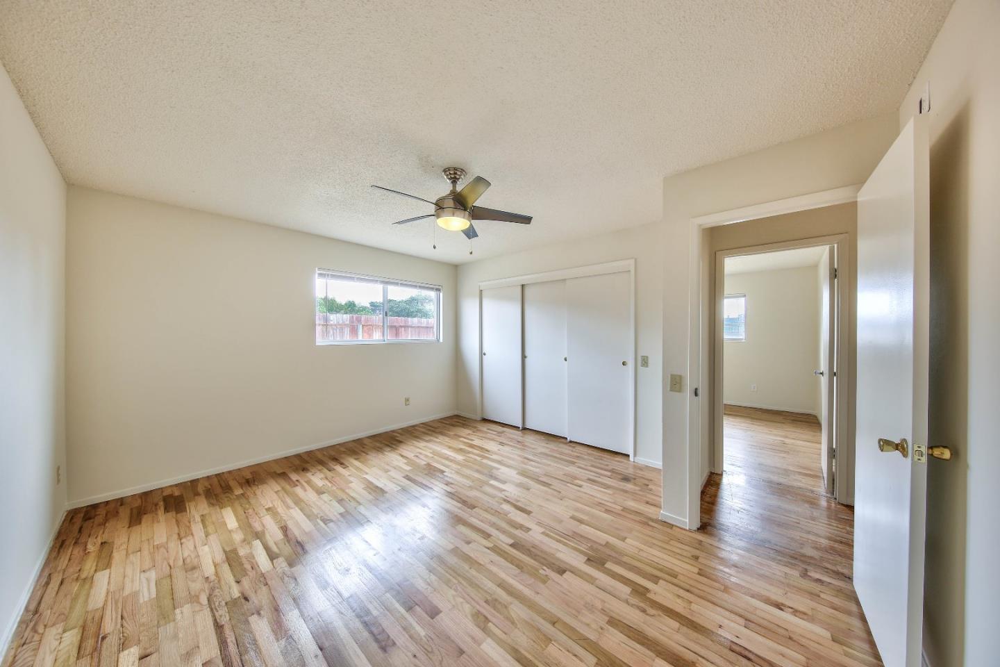3283 Michael Drive Marina, CA 93933 - Photo 11 of 19 wooden floor in an empty room with a window