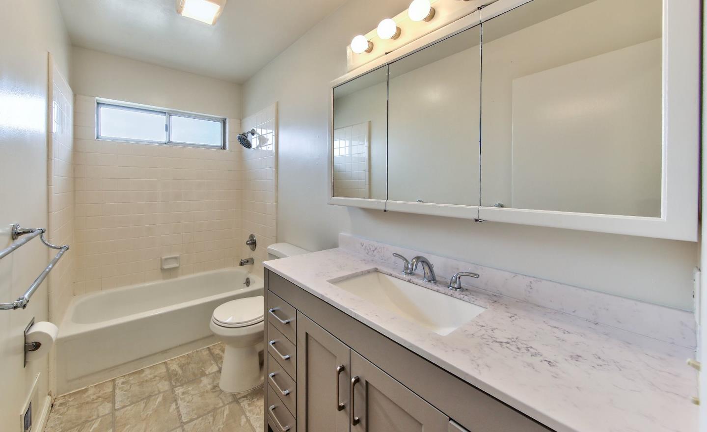 3283 Michael Drive Marina, CA 93933 - Photo 16 of 19 a bathroom with a granite countertop sink toilet and shower